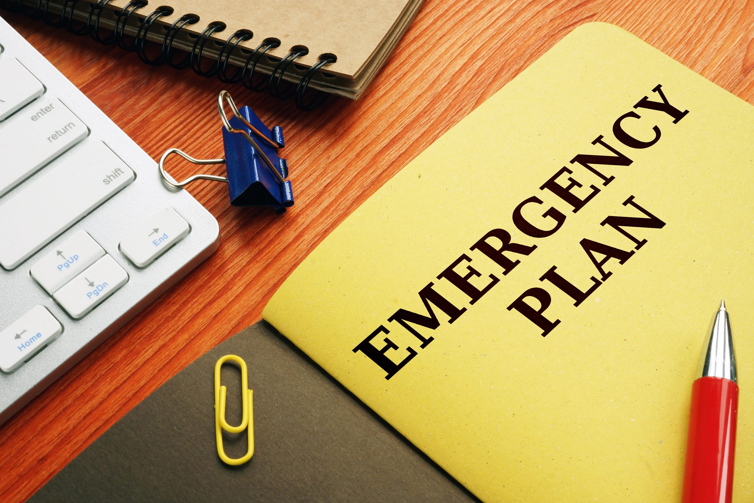 Emergency plan or Disaster Preparedness on the desk.